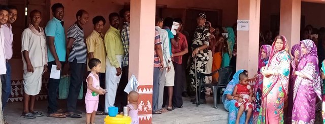 Voters casting their votes Odisha records 66% polling in fourth phase